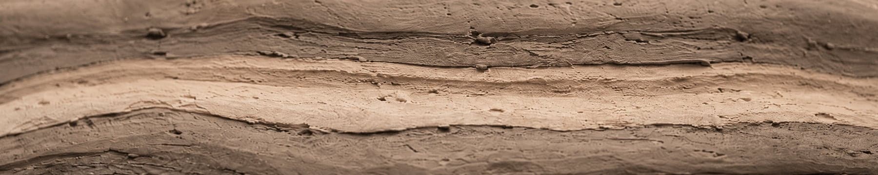 Layered clay strata in cross-section