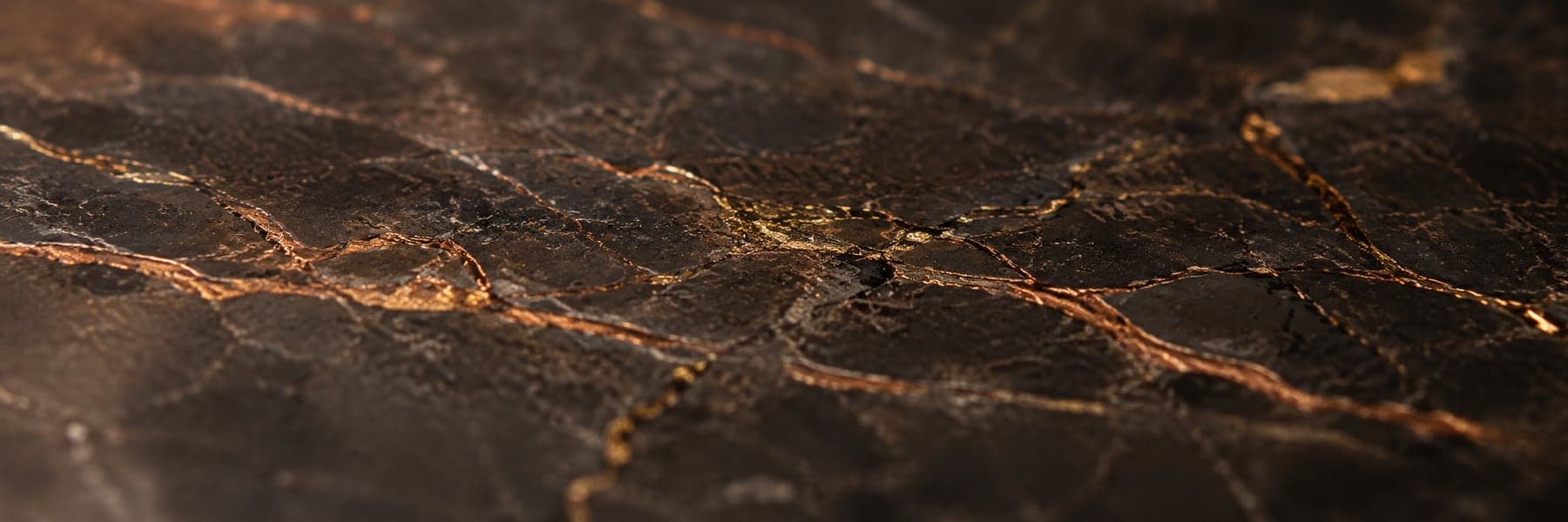 Polished copper-veined dark stone